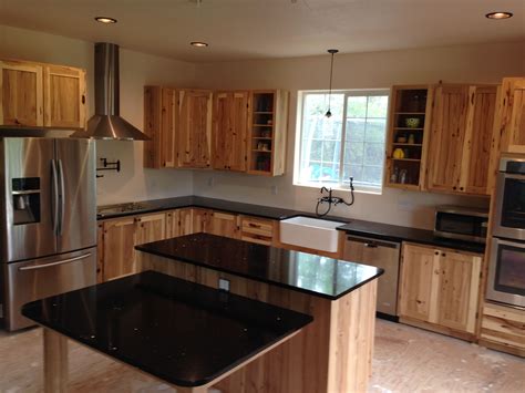 kitchen with hickory cabinets and stainless steel appliances|countertops with hickory kitchen cabinets.